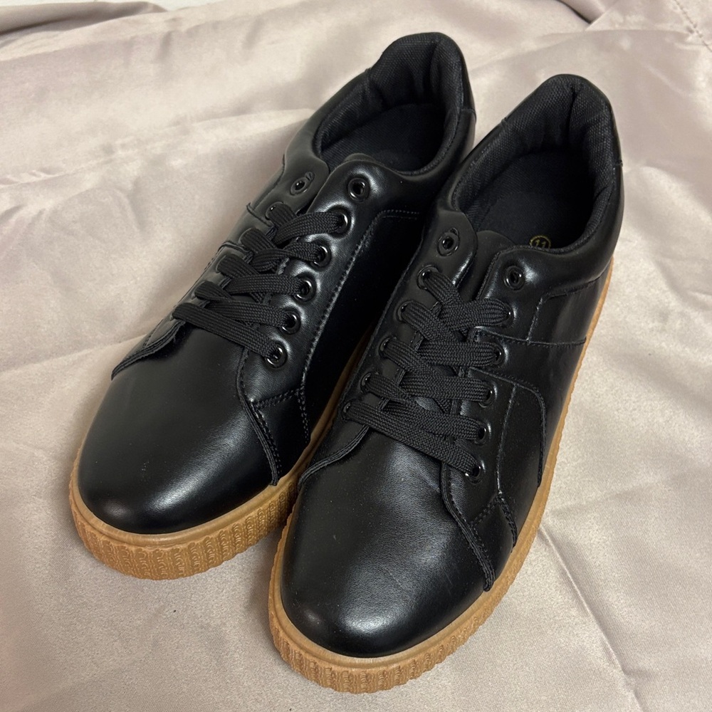 Elegant Black Women's Sneakers with Brown Sole